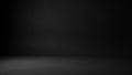 Dark studio background with a subtle spotlight illuminating the floor and creating a moody atmosphere Keywords Royalty Free Stock Photo