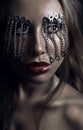 Dark studio beauty portrait with chains