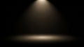 Dark studio with a single spotlight illuminating the floor Royalty Free Stock Photo
