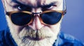 Dark Sunglasses close up. Brutal handsome man with. Stylish bearded man. A beautiful and charming man with sunglasses. Royalty Free Stock Photo