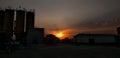 Dark sunset is falling over construction batching plant