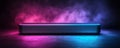 On a dark surface, a sleek metallic box emits a vibrant glow of purple and pink Royalty Free Stock Photo