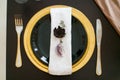 Black and yellow table setting