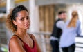 Dark tan skin mixed race woman act as upset or unhappy when she found her boy friend talk and close to the other girls Royalty Free Stock Photo
