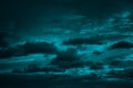 Dark teal cloudy sky. Night skies with clouds. Gloomy sky background for design.