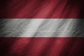 Dark textile background or texture with blending Austria flag