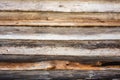 Dark texture of an ancient wooden wall built of logs and moss, a Royalty Free Stock Photo