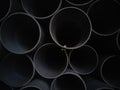 Dark texture of end view of PVC plastic water drain pipes. Royalty Free Stock Photo