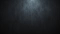 Dark textured background with subtle light effect creating a dramatic and moody atmosphere Royalty Free Stock Photo