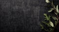 Dark textured fabric background with a subtle grid pattern fills most of the image.