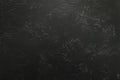 Dark textured surface with abstract markings and subtle rough patterns Royalty Free Stock Photo