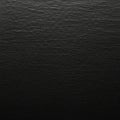 Dark, textured surface resembling black paper or fabric with a subtle grain pattern. Royalty Free Stock Photo