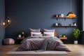 Dark themed bedroom with a bold dark blue wall, presented mockup