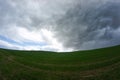 Dark thundercloud approaching the blue sky