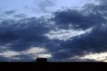 Dark thunderclouds in the sky above a house