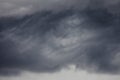 Dark thunderstorm cloud overcasting the moody sky for background design purpose