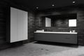 Dark tile bathroom corner with sink and wardrobe Royalty Free Stock Photo