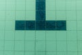 Dark tiles of a pool in the shape of a T that identifies the arrival in a pool