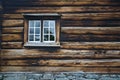 Dark timbered wooden wall with window Royalty Free Stock Photo