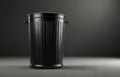 Dark trash can on a plain advertising background. Concept of ecology saving, recycling Royalty Free Stock Photo