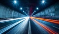 Long exposure of speeding cars in a dark tunnel with bright lights Royalty Free Stock Photo
