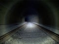 Dark tunnel railway with flash lamp light