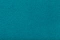 Dark turquoise matt suede fabric closeup. Velvet texture of felt Royalty Free Stock Photo