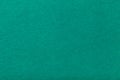 Dark turquoise matt suede fabric closeup. Velvet texture of felt Royalty Free Stock Photo