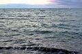 Dark turquoise rippling sea at sunset