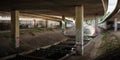 Dark underbridge with columns and graffiti Royalty Free Stock Photo