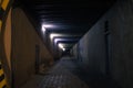 Dark underground passage at night criminal time with electricity lighting and shadow dusk environment no people here square shape