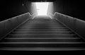 Dark underground stairs leading up into the light Royalty Free Stock Photo