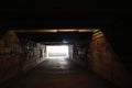 dark underpass descent into the tunnel under the street