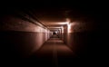 Dark underpass with dim lights and graffitis