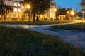 Dark urban illuminated city alley at night Royalty Free Stock Photo