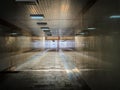 Dark urban underpass, long tunnel with marble walls Royalty Free Stock Photo