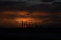 Dark view of a factory at sunset - concept of pollution