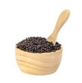 Dark violet rice berry with wooden bowl and spoon isolated on white background Royalty Free Stock Photo