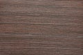 Dark walnut, natural wood surface with deep wavy stripes