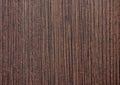 Dark walnut, polished flat surface of natural dark wood close-up. Background, texture Royalty Free Stock Photo