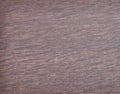 Dark walnut with a red tint, surface treated natural wood surface close-up