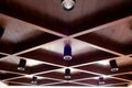 Dark walnut wooden coffered ceiling and modern LED lights