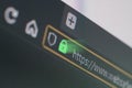Dark web browser close-up on LCD screen with shallow focus on https padlock Royalty Free Stock Photo