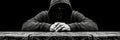 Dark web hacking cybercriminal at work in front of computer, engaging in illegal activities