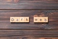 Dark web word written on wood block. Dark web text on cement table for your desing, concept