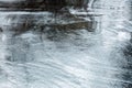 Dark wet asphalt road surface with puddles and raindrops Royalty Free Stock Photo