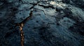 Dark Wet Ground with Cracks and Reflection of Light at Dusk Royalty Free Stock Photo