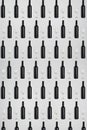 Dark wine bottles and glasses. Creative dark and textured abstract background. Royalty Free Stock Photo