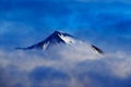 Dark winter mountain with snow in the clouds, blue landscape, Svalbard, Norway