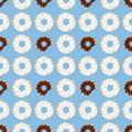 Dark and withe chocolate donuts with blue background